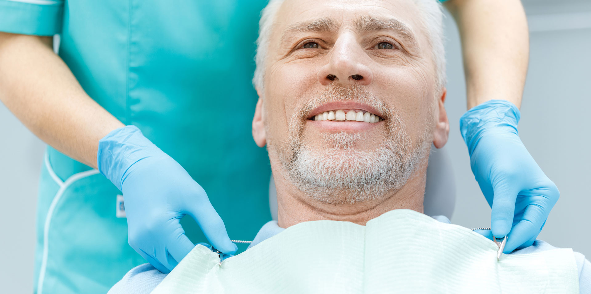 A man getting ready for dental implants treatment